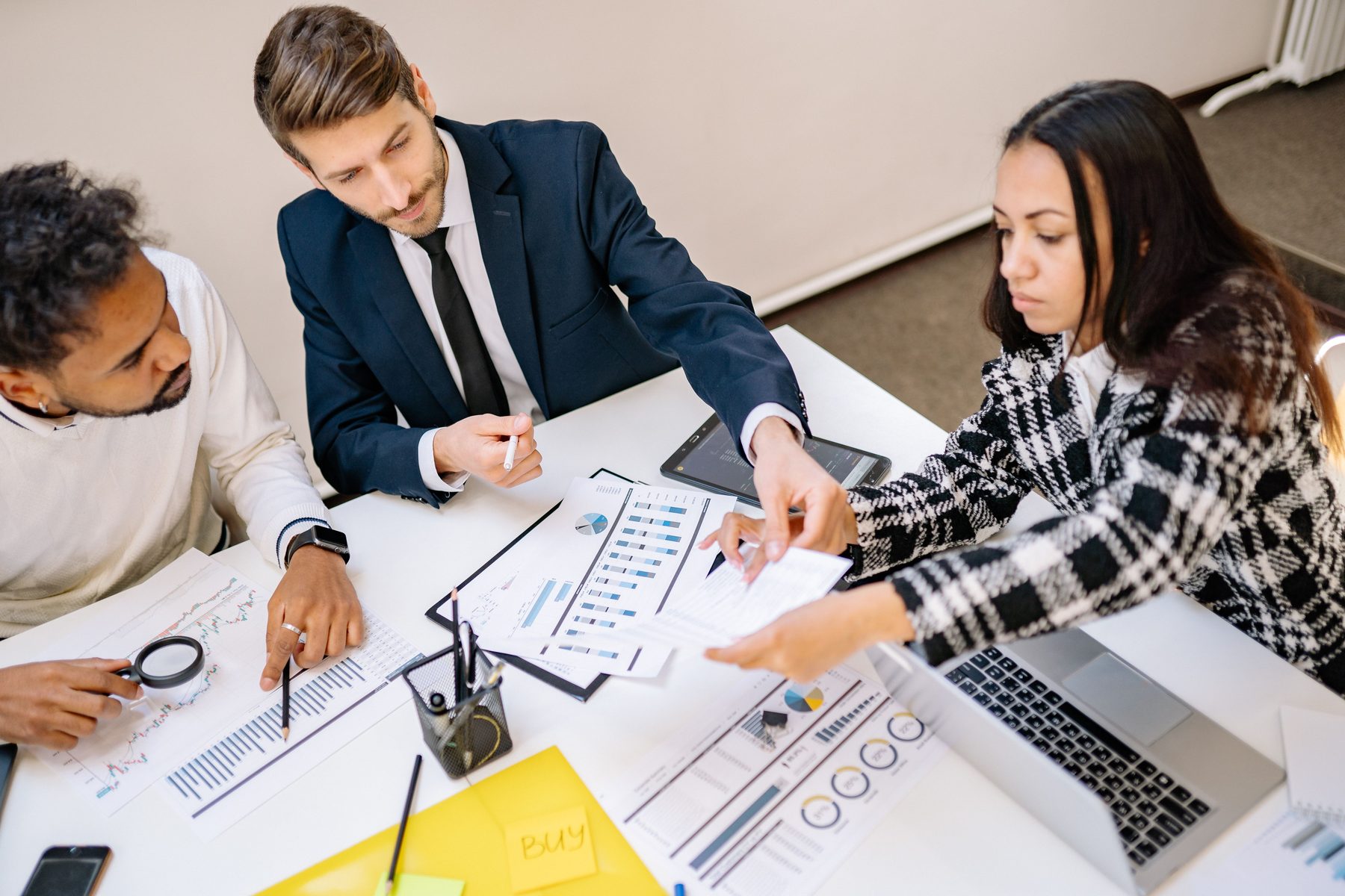 A team working through reports together in a planning session